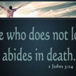 What does “passed from death to life” mean in 1 John 3:14?