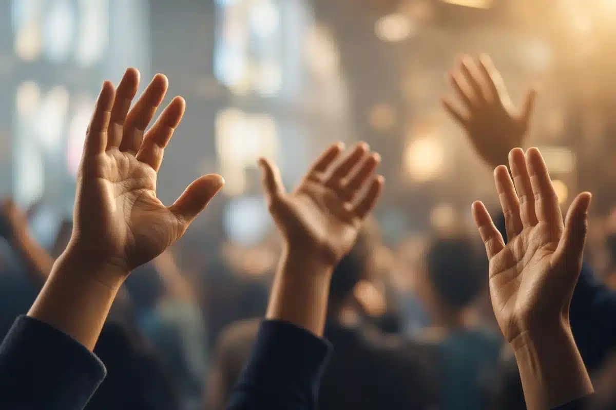 Open hands raised in worship, picturing the question are spiritual gifts for today